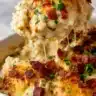 Delicious creamy Southern smothered chicken served with gravy and sides.