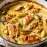 Delicious French Chicken Casserole a la Normande served in a rustic dish.